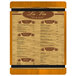 A Menu Solutions Country Oak wood menu board with rubber band straps.