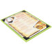 A Menu Solutions wood menu board with lime green picture corners.