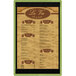 A Menu Solutions wood menu board with a green frame holding a white menu.