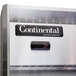 A close-up of a Continental stainless steel reach-in refrigerator with solid half doors.