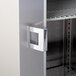 A Continental Reach-In Refrigerator metal door with a handle.