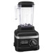 A matte black KitchenAid commercial blender with a clear glass container.