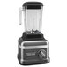 A KitchenAid dark pewter commercial food blender with a glass container.