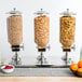 A Choice triple cereal dispenser filled with cereal and fruit.