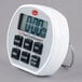 A white Cooper-Atkins digital kitchen timer with black buttons.
