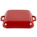 A red square GET Heiss mini square grill pan with white enamel coating and handles.