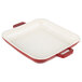 A red and white enamel coated square grill pan with handles.