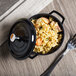 A black GET Heiss mini round bistro pot with rice and shrimp in it.