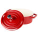 A red and white enamel coated cast aluminum oval pot with lid and handle.