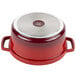 A red and white GET Heiss cast aluminum Dutch oven with lid.