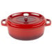 A red oval Dutch oven with a lid.