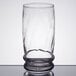 A close-up of a Libbey Cascade cooler glass with a rim.