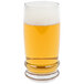 A close up of a Libbey Cascade cooler glass full of beer with foam.