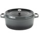 A gray enamel coated oval Dutch oven with a lid.
