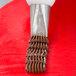 A close up of an Ateco Basketweave piping tip on a pastry bag.