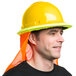 A man wearing a yellow Cordova Duo full-brim hard hat with a black shirt and orange hoodie.