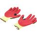 A pair of yellow and red Cordova heavy duty work gloves with yellow and red palm coating.