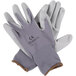 A pair of Cordova gray nylon gloves with gray polyurethane palm coating on a white background.
