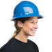 A woman wearing a Cordova blue hard hat with a smile.