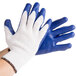 A pair of large Cordova work gloves with blue latex palms.