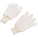 A pair of white Cordova polyester/cotton work gloves with red stitching.
