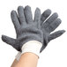 A pair of Cordova gray jersey work gloves with white lining.