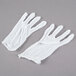 A pair of white Cordova Men's Lightweight Cotton Reversible Lisle Gloves.