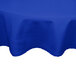 A royal blue Intedge round poly/cotton table cover on a table.