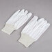 A pack of Cordova white work gloves with red stripes.