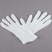 A pair of white Cordova Men's heavy weight polyester/cotton lisle gloves.