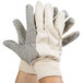 A pair of Cordova work gloves with black PVC dotted palms.