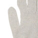 A close up of a Cordova medium weight natural cotton jersey glove with a thumb.