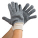 A pair of Cordova loop-out work gloves in grey and white.