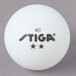 A pack of 6 Stiga white ping pong balls with black text.