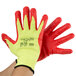 A pair of yellow gloves with red foam nitrile palms.