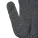 A close up of a large gray Cordova jersey glove with a thumb.