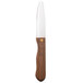 A Walco stainless steel steak knife with a stained hardwood handle.