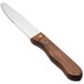 A Walco stainless steel steak knife with a stained hardwood handle.