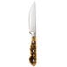 A Walco stainless steel steak knife with a wooden handle and a black Delrin accent.