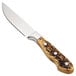 A Walco stainless steel steak knife with a Delrin handle featuring a wooden appearance.