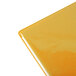 A close up of a yellow plastic Menu Solutions Hamilton Mandarin menu board cover.