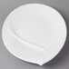 A Villeroy & Boch white porcelain oval platter with a curved edge.