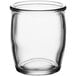 An Acopa clear glass sauce cup with a white background.