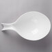 A white Villeroy & Boch porcelain deep handled bowl with a spoon inside.