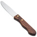 A Walco stainless steel steak knife with a dark hardwood handle.