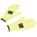 A pair of medium yellow Cordova cut resistant gloves with yellow and black markings.