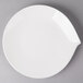 A white Villeroy & Boch porcelain flat plate on a gray surface.
