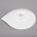 A white Villeroy & Boch porcelain saucer with a leaf shaped design.