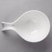 A Villeroy & Boch white porcelain handled bowl on a gray surface.