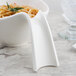 A Villeroy & Boch white porcelain handled bowl with spaghetti and a fork.